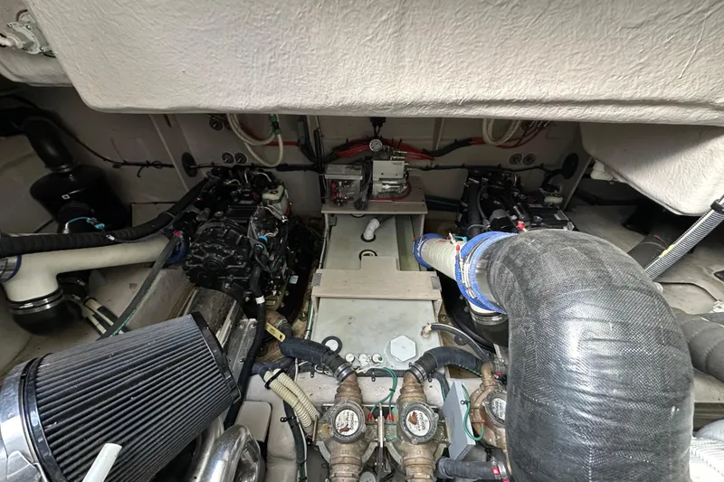 Slide: The Image of Engine room of a 2014 Sea Ray Sundancer 510 yacht, showcasing mechanical components. - 36