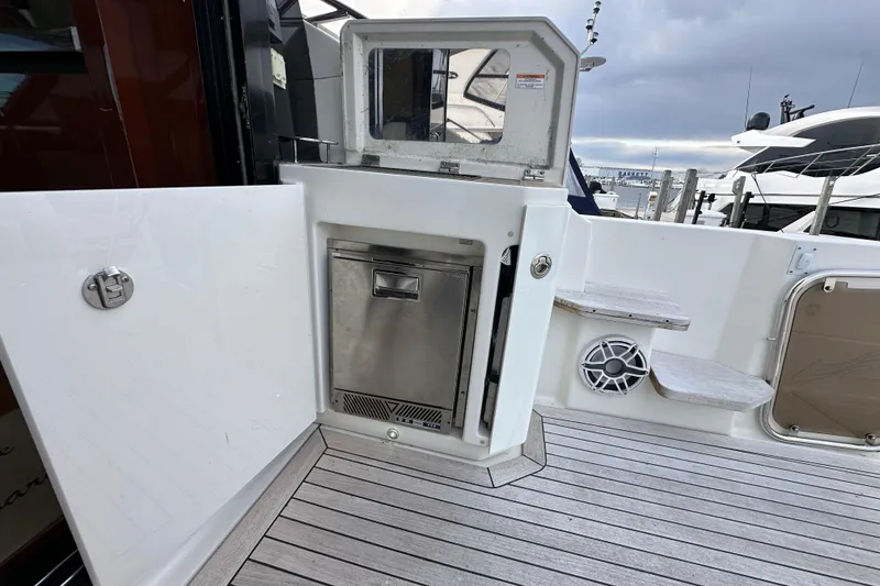 Slide: The Image of 2014 Sea Ray Sundancer 510 yacht deck with built-in storage and steps. - 6
