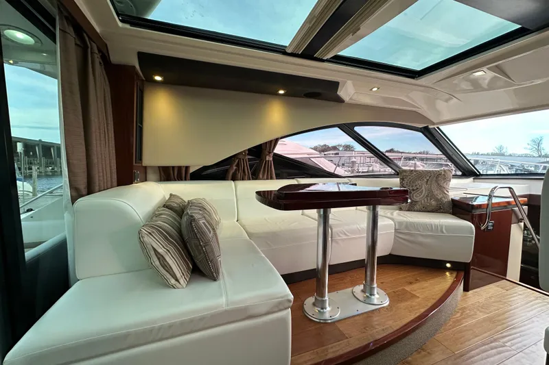 Slide: The Image of Luxurious interior of 2014 Sea Ray Sundancer 510 yacht with plush seating and elegant decor. - 8