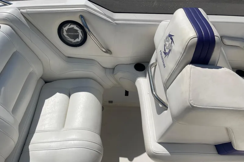 Slide: The Image of Interior of a 1998 Fountain 29 Fever boat with white leather seating. - 13