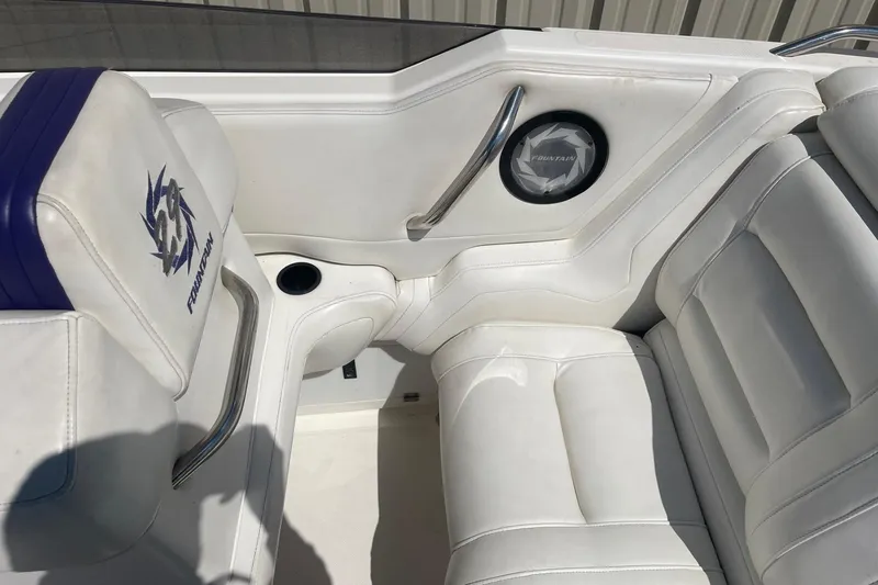 Slide: The Image of Interior of a 1998 Fountain 29 Fever boat with white leather seating. - 14