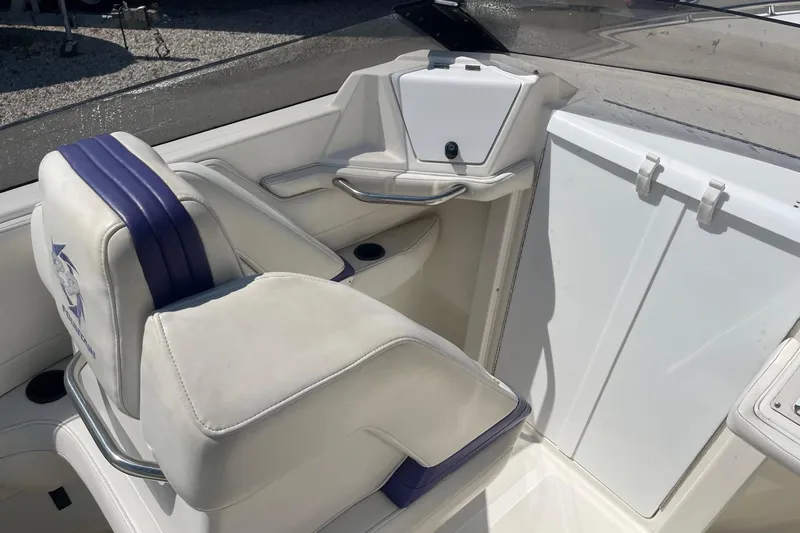Slide: The Image of 1998 Fountain 29 Fever boat interior with white and purple seating. - 16