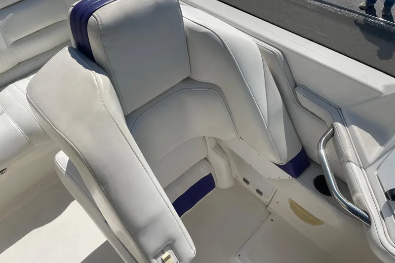Slide: The Image of 1998 Fountain 29 Fever boat interior with white and purple seating. - 17