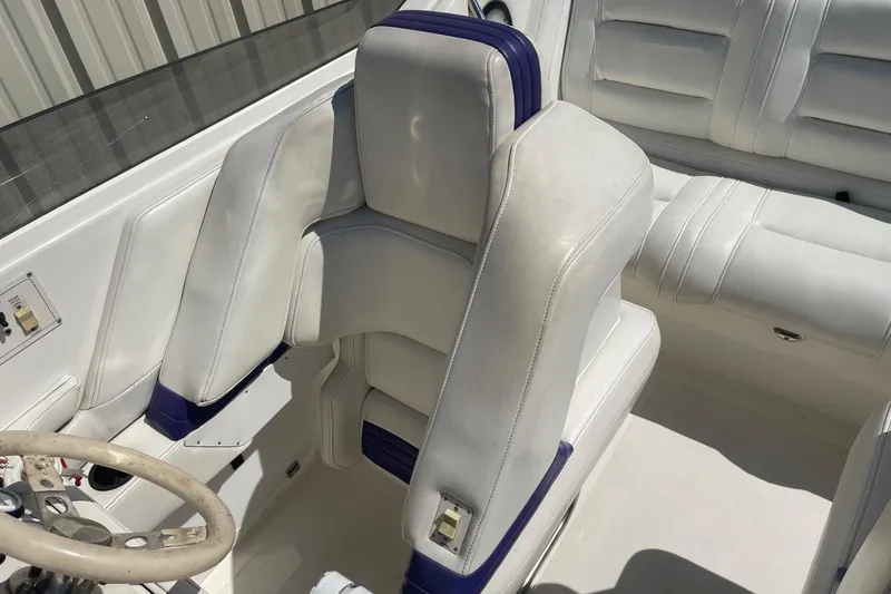 Slide: The Image of 1998 Fountain 29 Fever boat interior with white and blue seating. - 19