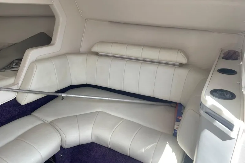 Slide: The Image of Interior of a 1998 Fountain 29 Fever boat with white leather seating. - 26
