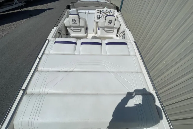 Slide: The Image of 1998 Fountain 29 Fever boat interior with white seating and dashboard. - 5