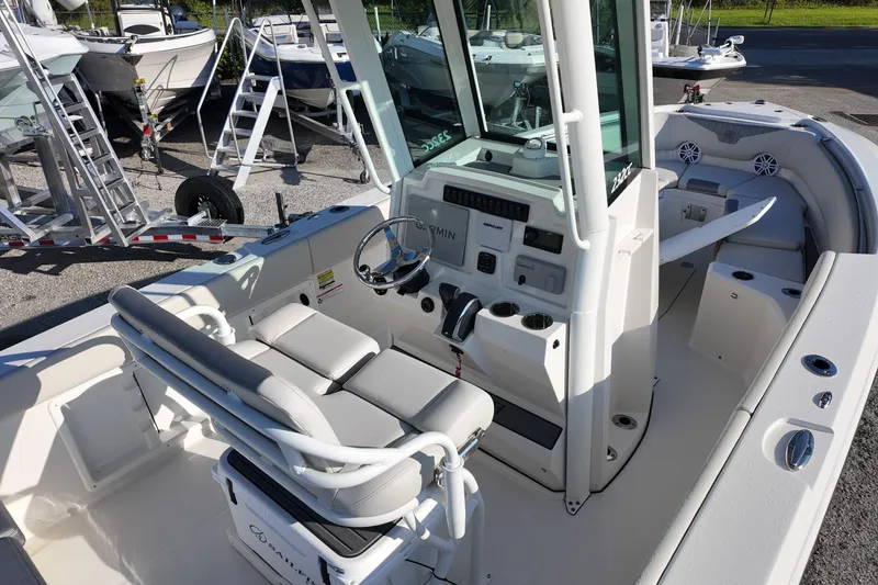 Slide: The Image of 2026 Sailfish 232 CC boat interior with helm, seating, and controls. - 4