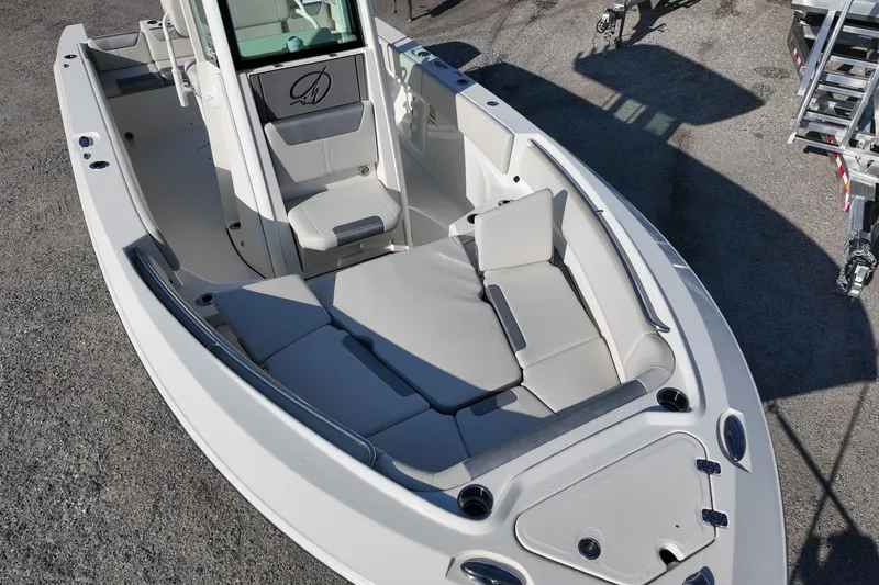 Slide: The Image of 2026 Sailfish 232 CC boat interior with cushioned seating and modern design. - 6