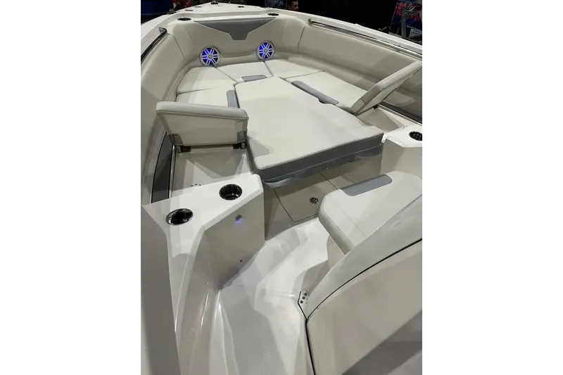 Slide: The Image of 2026 Sailfish 232 CC boat interior with cushioned seating and cup holders. - 7