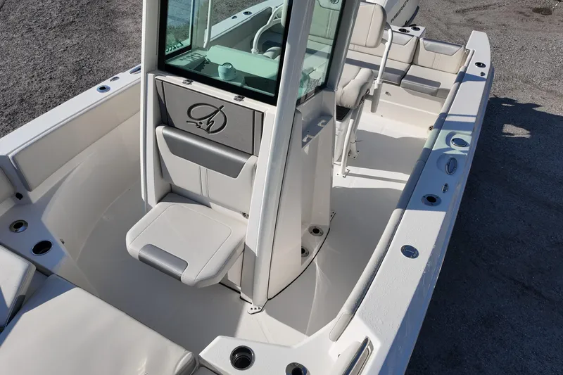 Slide: The Image of 2026 Sailfish 232 CC boat interior with seating and console, showcasing modern design. - 8