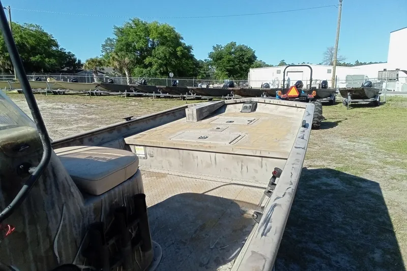 Slide: The Image of 2015 SeaArk 170 RX boat on trailer in outdoor storage area. - 16
