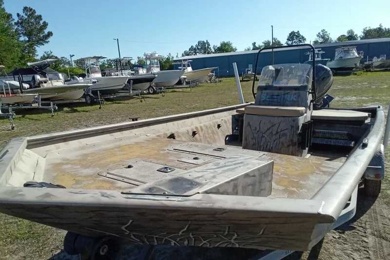 Slide: The Image of 2015 SeaArk 170 RX boat on trailer in outdoor storage area. - 7