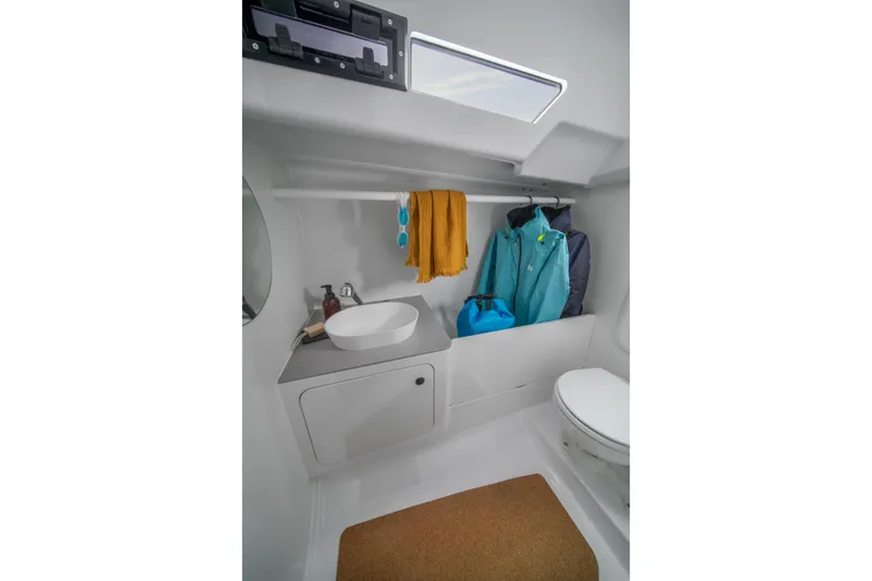 Slide: The Image of Modern bathroom interior of 2026 Beneteau First 30 yacht with sink and storage. - 10