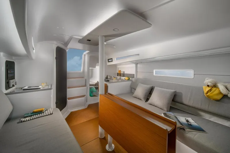 Slide: The Image of Interior of 2026 Beneteau First 30 sailboat, featuring modern design and cozy seating area. - 7