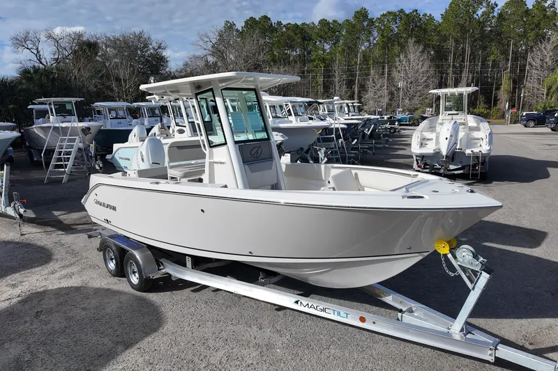 The Image of 2026 Sailfish 232 CC boat on trailer in outdoor showroom. - 0