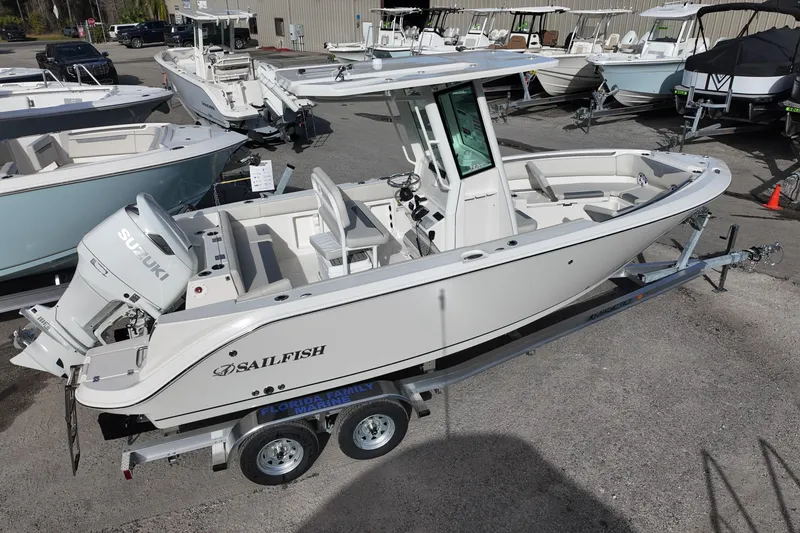 Slide: The Image of 2026 Sailfish 232 CC boat on trailer, featuring Suzuki outboard motor. - 2