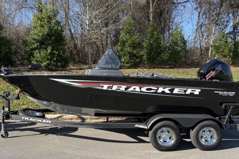 The Image of 2026 Tracker Pro Guide V-175 Combo boat on trailer, parked outdoors. - 0