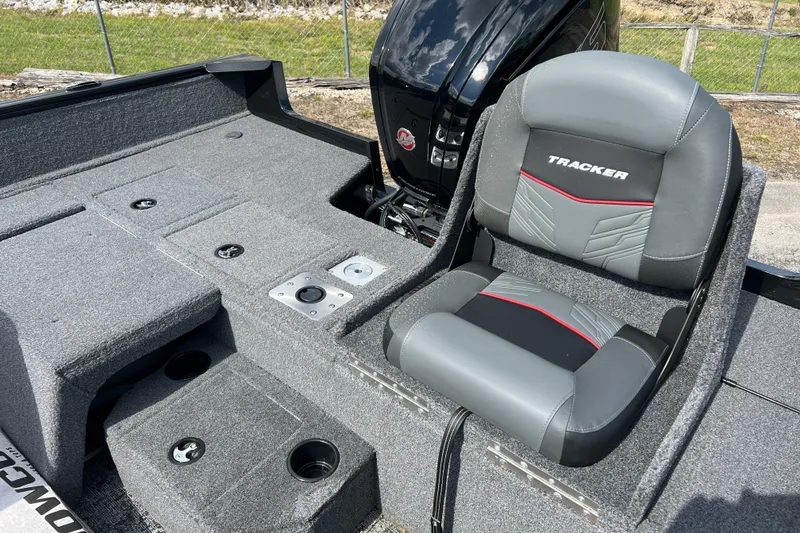 Slide: The Image of 2026 Tracker Pro Guide V-175 Combo boat interior with cushioned seating and storage compartments. - 3