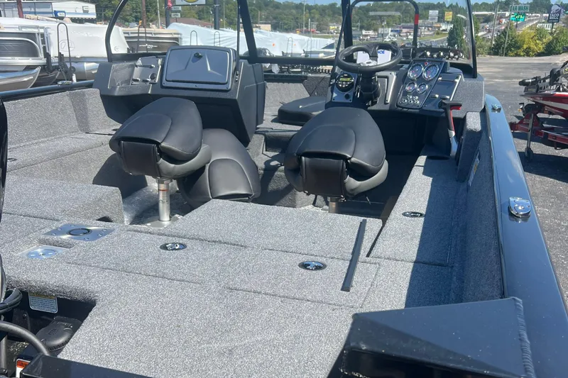 Slide: The Image of 2026 Tracker Pro Guide V-175 Combo boat interior with dual seats and control panel. - 4