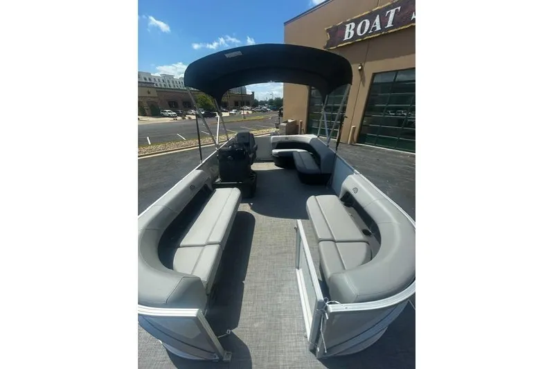 Slide: The Image of 2026 Sun Tracker Party Barge 16 DLX pontoon boat with spacious seating and canopy. - 4
