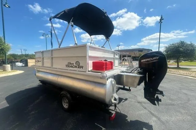 Slide: The Image of 2026 Sun Tracker Party Barge 16 DLX pontoon boat with Mercury engine on a sunny day. - 3