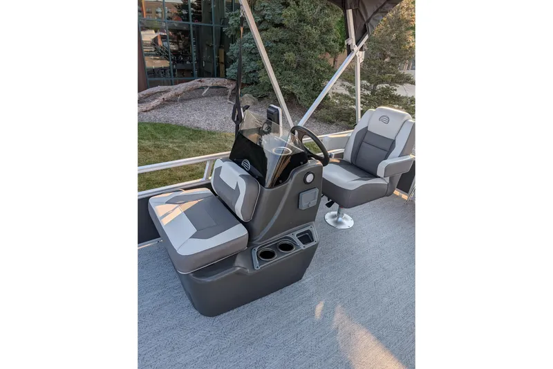 Slide: The Image of 2026 Sun Tracker Bass Buggy 16 XL Select interior with comfortable seating and steering console. - 6