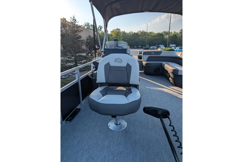 Slide: The Image of 2026 Sun Tracker Bass Buggy 16 XL Select pontoon boat interior with seating and steering console. - 3