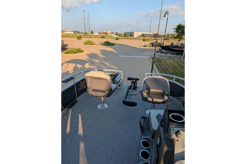 Slide: The Image of 2026 Sun Tracker Bass Buggy 16 XL Select pontoon boat interior with seating and controls. - 8