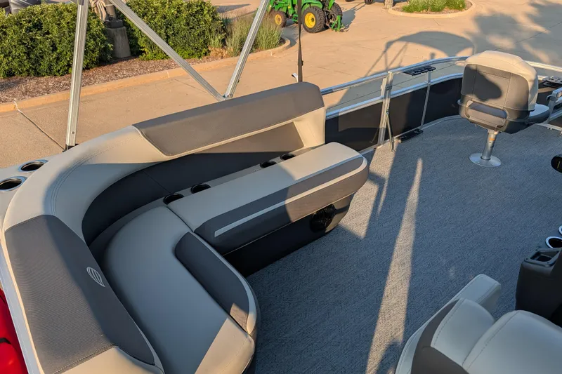 Slide: The Image of 2026 Sun Tracker Bass Buggy 16 XL Select pontoon boat interior with seating and cup holders. - 5