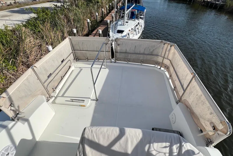 Slide: The Image of 2020 Beneteau Swift Trawler 35 flybridge with covered seating and helm chair. - 4