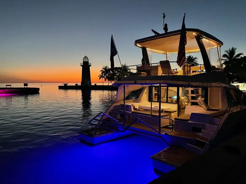 The Image of Leopard 43 PC yacht at sunset with lighthouse in background, 2019 model. - 0