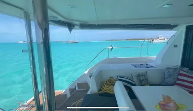 Slide: The Image of Leopard 43 PC 2019 yacht overlooking turquoise waters. - 11