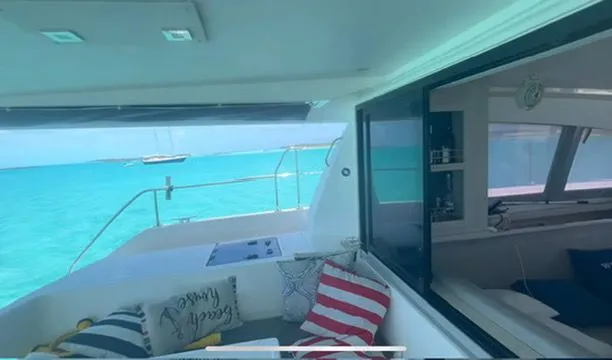 Slide: The Image of Interior view of a 2019 Leopard 43 PC yacht overlooking turquoise waters. - 12