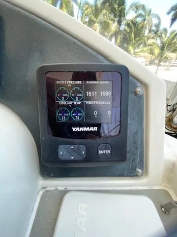 Slide: The Image of Yanmar monitor on 2019 Leopard 43 PC with palm trees in background. - 19