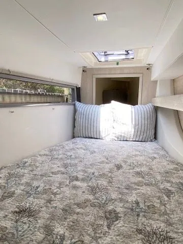 Slide: The Image of Interior of Leopard 43 PC yacht, cozy bed with skylight. - 23