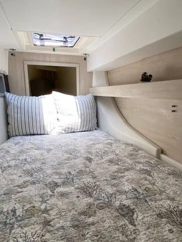 Slide: The Image of Interior of a 2019 Leopard 43 PC with cozy bed and skylight. - 24