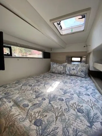 Slide: The Image of Interior of a 2019 Leopard 43 PC with cozy bed and skylight. - 29
