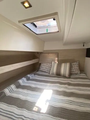 Slide: The Image of Interior of a 2019 Leopard 43 PC with cozy bed and skylight. - 30