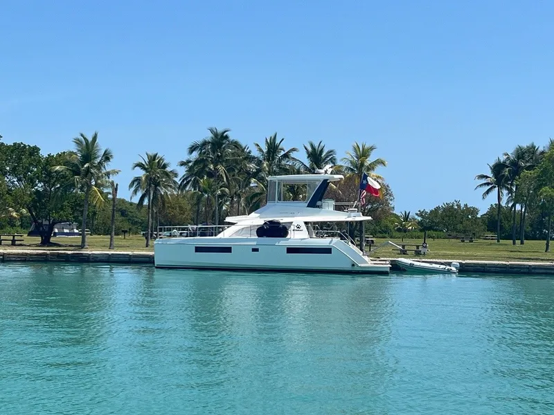Slide: The Image of Leopard 43 PC 2019 yacht docked in tropical harbor with palm trees. - 34