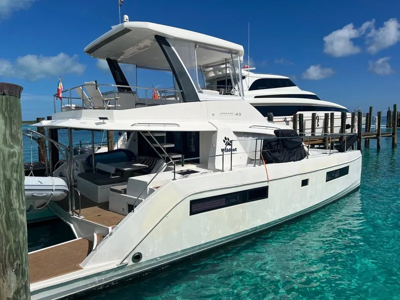 Slide: The Image of Leopard 43 PC 2019 yacht docked, clear water, blue sky. - 5