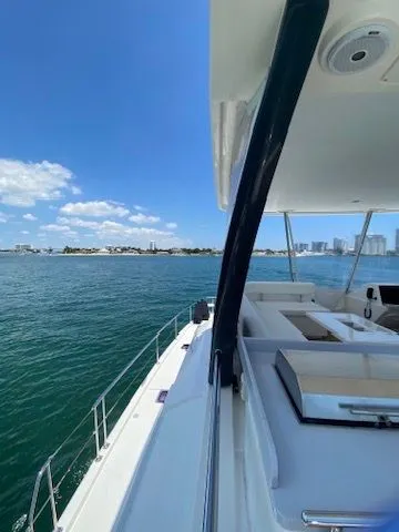 Slide: The Image of Leopard 43 PC 2019 yacht on open water with city view. - 6