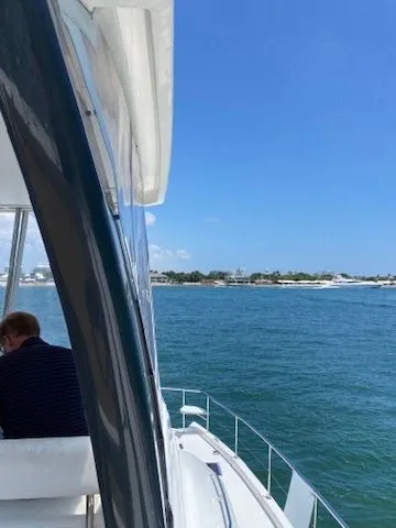 Slide: The Image of Leopard 43 PC 2019 on calm waters with coastal view. - 7