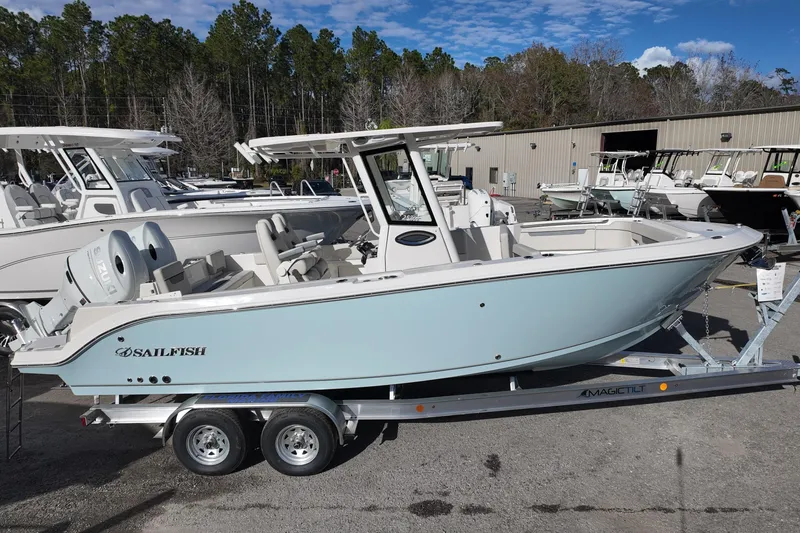 The Image of 2026 Sailfish 252 CC boat on trailer, displayed outdoors at a dealership. - 0