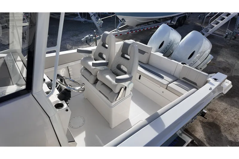 Slide: The Image of 2026 Sailfish 252 CC boat interior with dual engines and modern seating. - 11