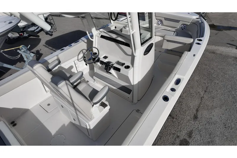 Slide: The Image of 2026 Sailfish 252 CC boat interior with dual seats and steering console. - 5
