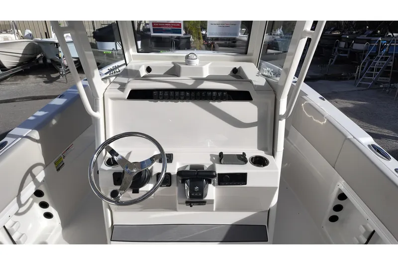 Slide: The Image of 2026 Sailfish 252 CC boat cockpit with steering wheel and control panel. - 6