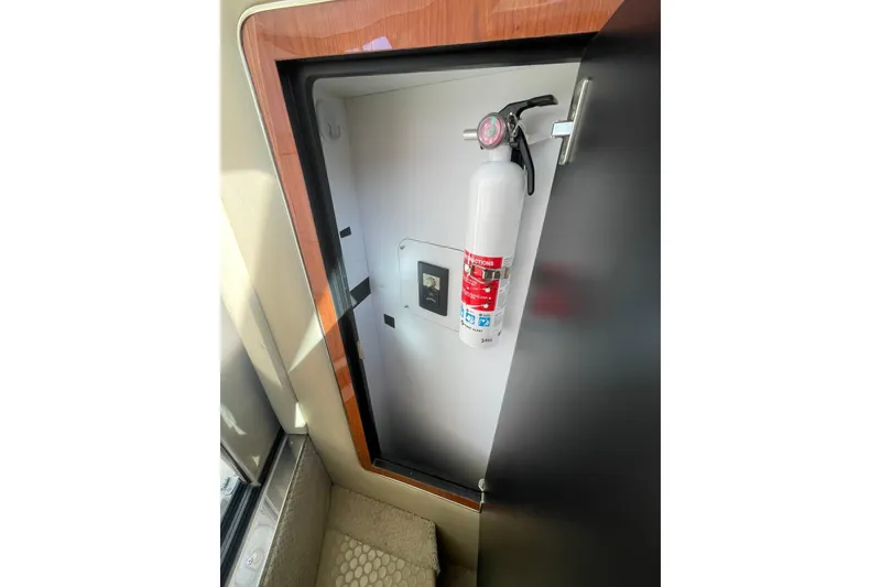 Slide: The Image of FIRE EXTINGUISHER IN CABINET AT SALON ENTRYWAY STEPS - 27