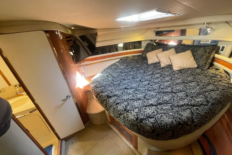 Slide: The Image of MASTER STATEROOM TO PORT SHOWING ENTRYWAY DOOR TO THE EN-SUITE HEAD & SHOWER - 30