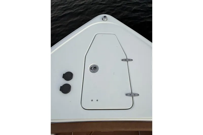 Slide: The Image of Bow view of 2024 Sea Hunt Ultra 265 SE boat, featuring storage hatch. - 13