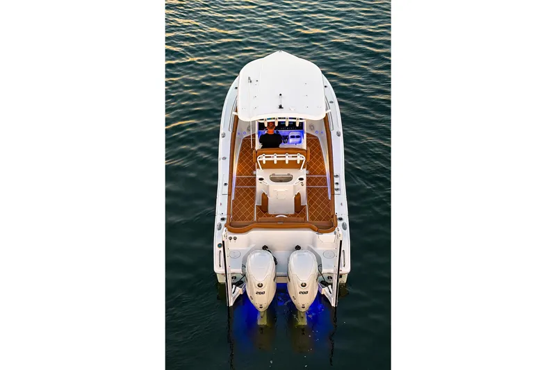 Slide: The Image of 2024 Sea Hunt Ultra 265 SE boat on water, aerial view, dual engines. - 17